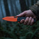 Hunter knife in hand - foggy woods