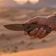 Sandman knife in hand in the desert