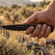 Honey Badger fixed blade knife in hand